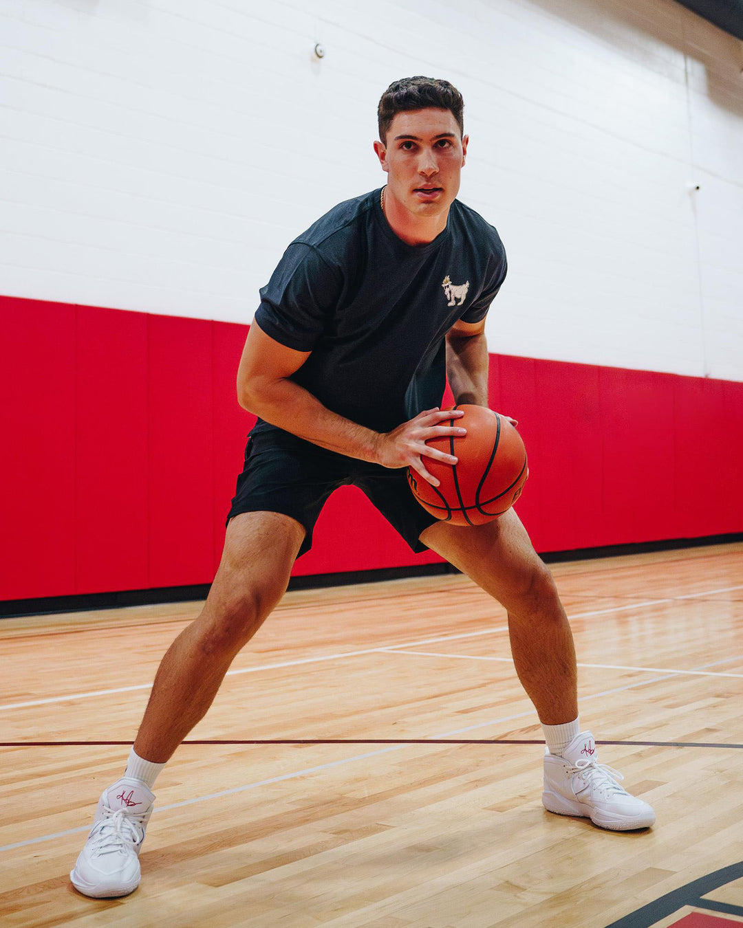 Basketball player wearing black OG Athletic T-Shirt#color_black