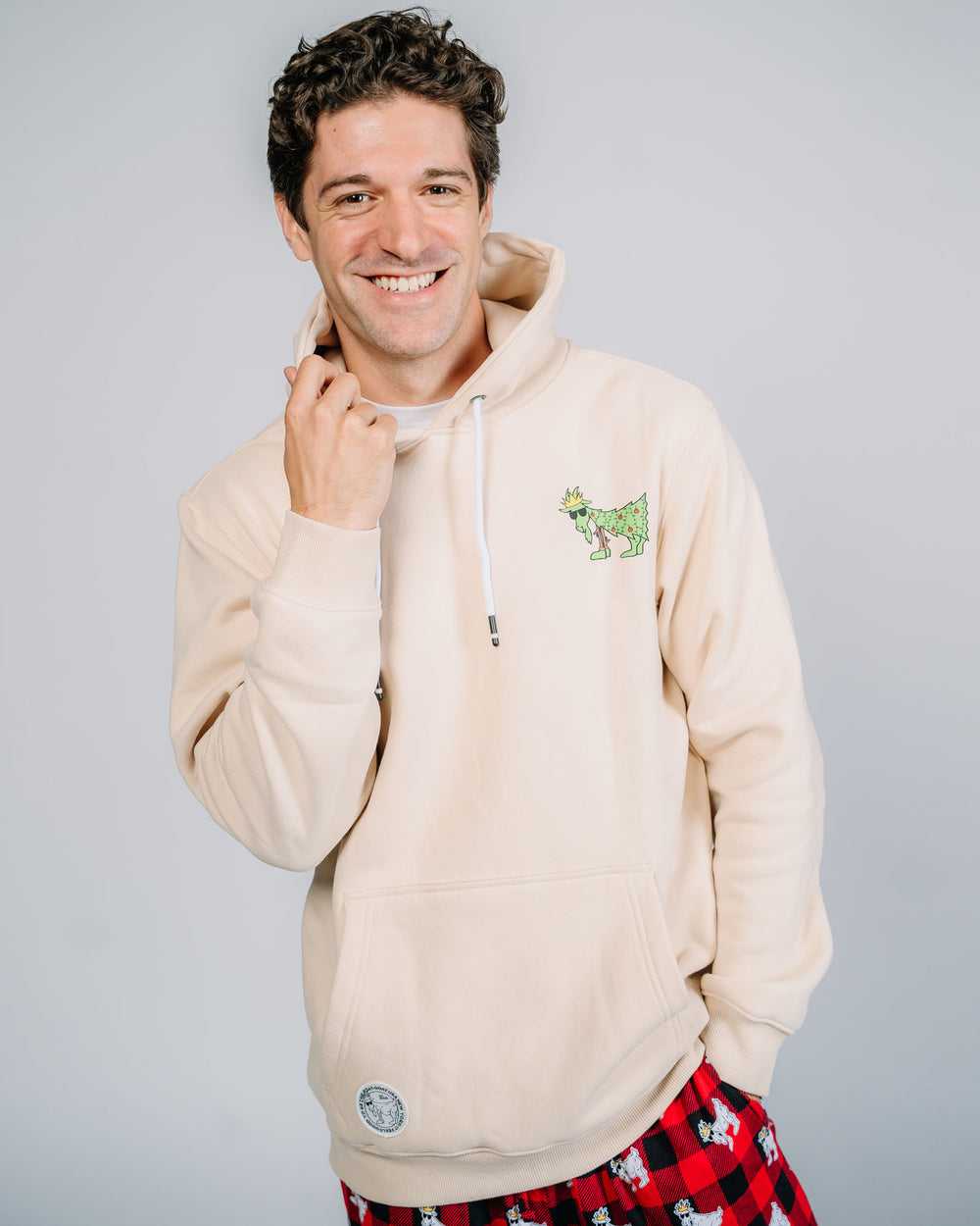 Male model wearing hoodie with Christmas tree goat