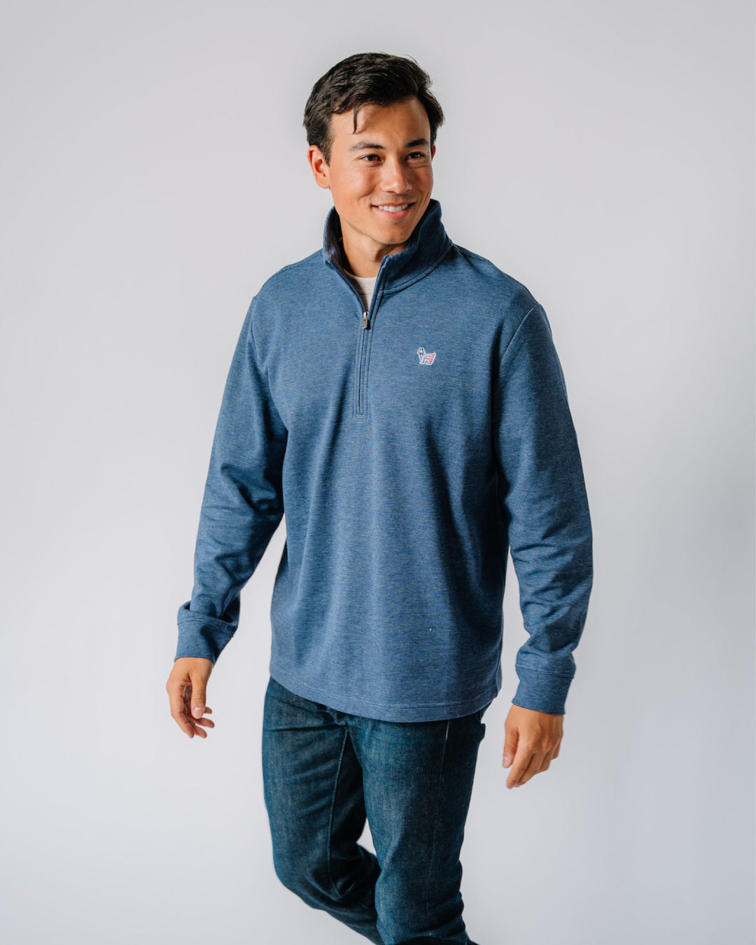 Model wearing Freedom Roosevelt Men's 1/4 Zip#color_navy