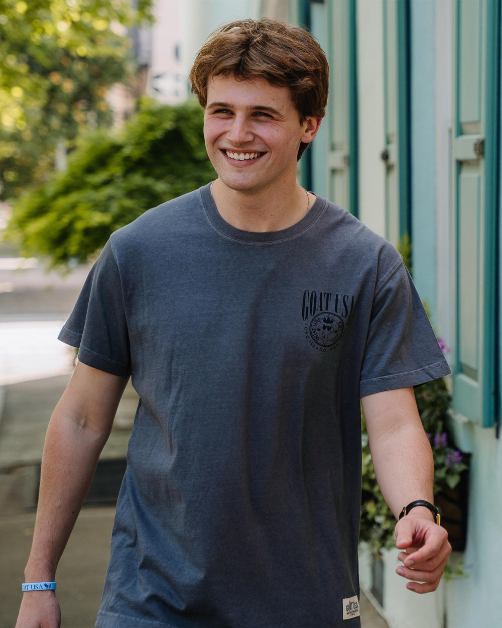 Man walking outside smiling in neighborhood on sunny day#color_pepper