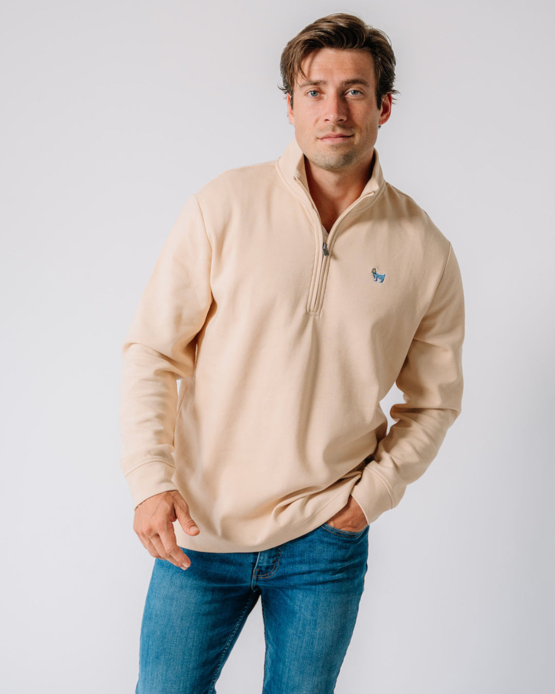 Model wearing tan OG Roosevelt Men's 1/4 Zip#color_tan