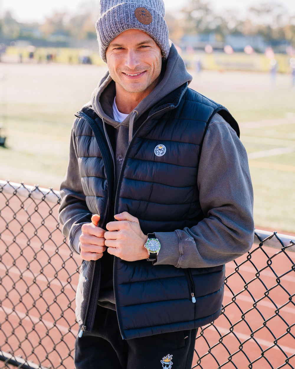 Model wearing black Men's Puffer Fleece Vest#color_black