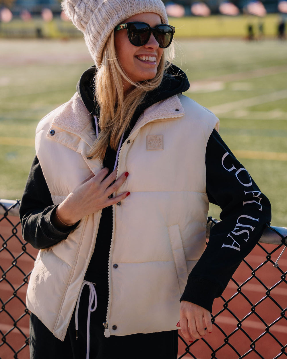 Model wearing ivory Women's Puffer Fleece Vest#color_ivory